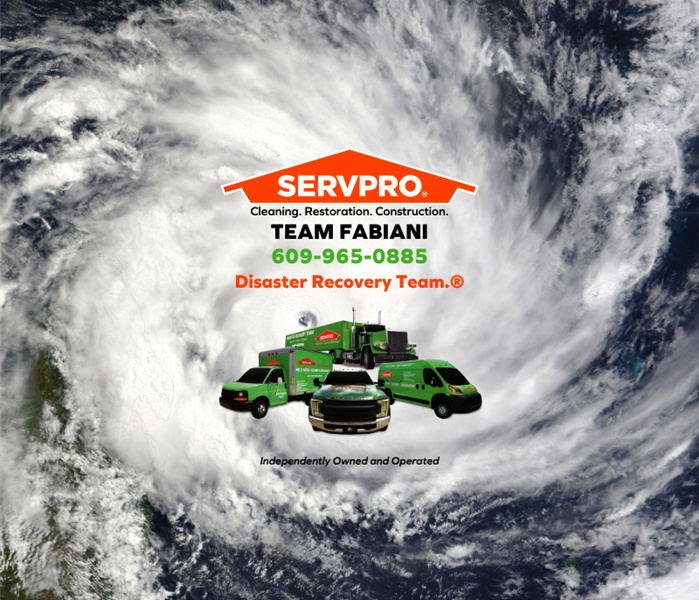 photo of hurricane on radar with SERVPRO logo and truck fleet
